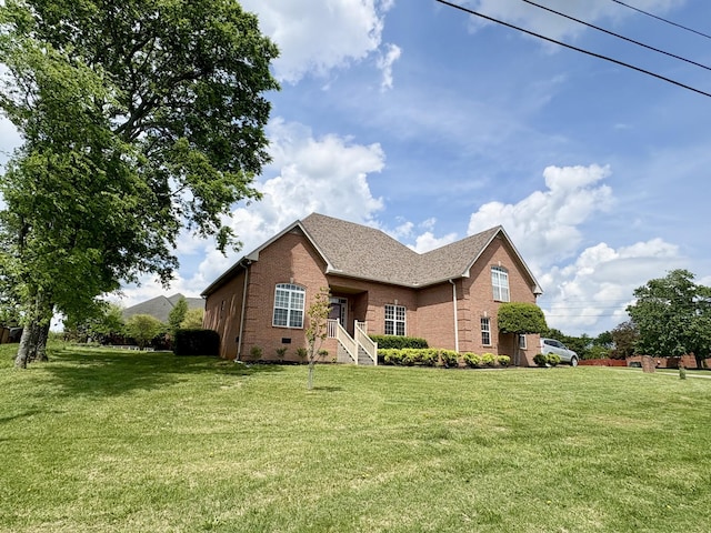 2001 Butler Cv, Lebanon, TN 37087 - traditional-style home with brick siding, a front lawn, and roof with shingles
