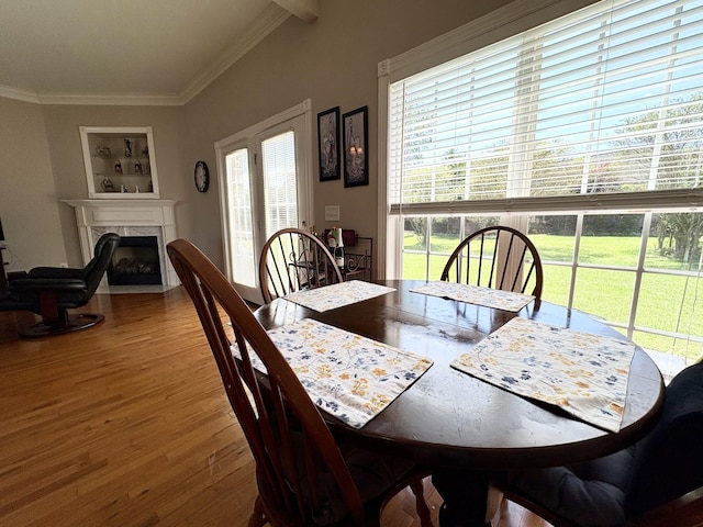 2001 Butler Cv, Lebanon, TN 37087 - dining room with wood finished floors, a fireplace, and ornamental molding