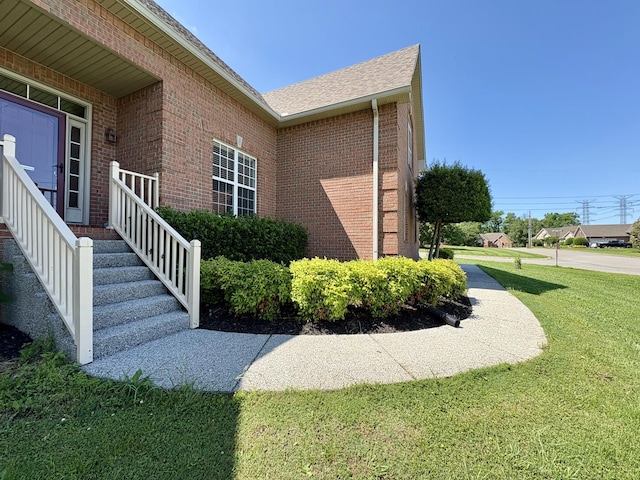 2001 Butler Cv, Lebanon, TN 37087 - view of side of property with brick siding, a yard, and a shingled roof