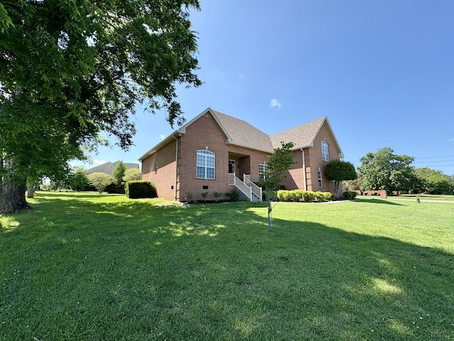 2001 Butler Cv, Lebanon, TN 37087 - view of property exterior with brick siding and a yard