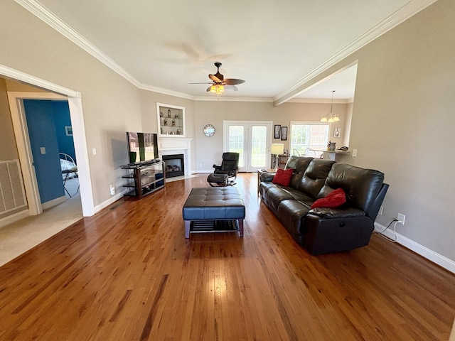 2001 Butler Cv, Lebanon, TN 37087 - living area featuring a ceiling fan, a high end fireplace, crown molding, wood finished floors, and baseboards