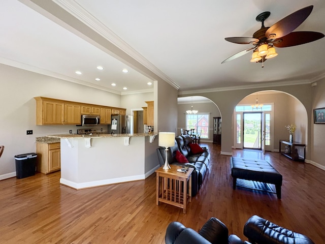 2001 Butler Cv, Lebanon, TN 37087 - living area with arched walkways, light wood-type flooring, baseboards, a chandelier, and recessed lighting
