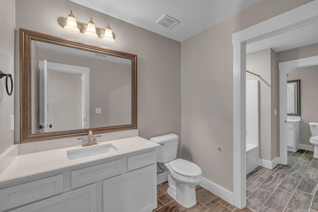 1118 Cotillion Dr, Murfreesboro, TN 37128 - full bathroom with visible vents, baseboards, vanity, and toilet