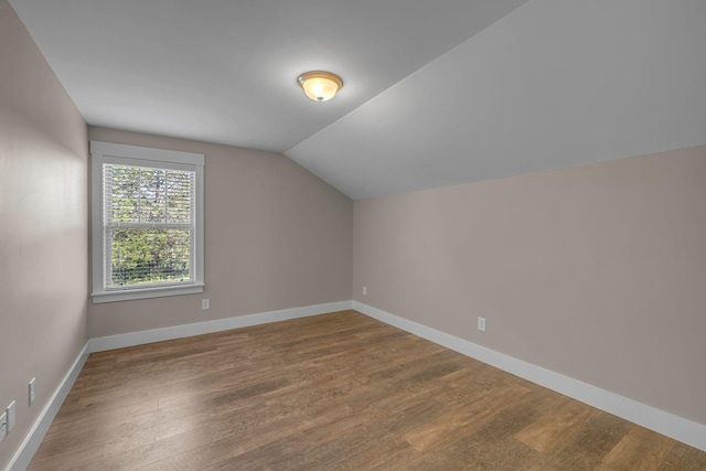 1118 Cotillion Dr, Murfreesboro, TN 37128 - additional living space with baseboards, vaulted ceiling, and wood finished floors