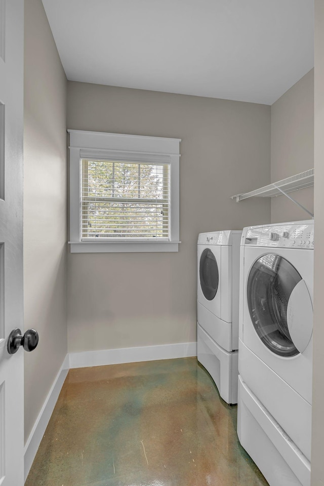 1118 Cotillion Dr, Murfreesboro, TN 37128 - laundry room with washing machine and clothes dryer, baseboards, and laundry area