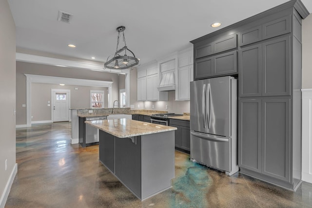 1118 Cotillion Dr, Murfreesboro, TN 37128 - kitchen with a sink, concrete flooring, a peninsula, appliances with stainless steel finishes, and recessed lighting