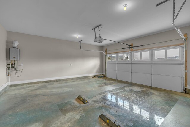 1118 Cotillion Dr, Murfreesboro, TN 37128 - garage featuring water heater, baseboards, and a garage door opener