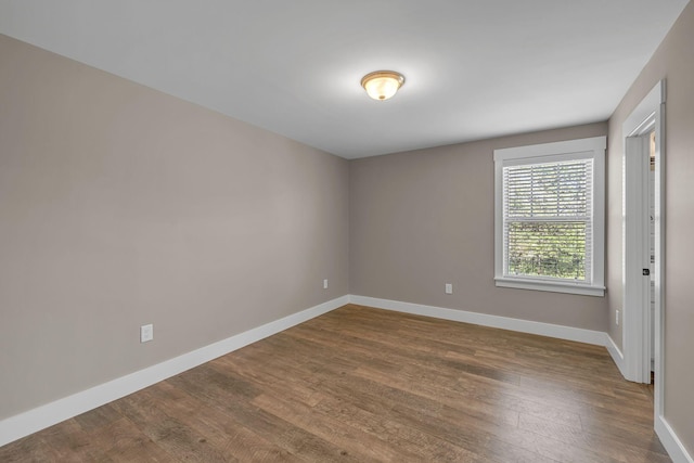 1118 Cotillion Dr, Murfreesboro, TN 37128 - spare room with baseboards and dark wood-type flooring