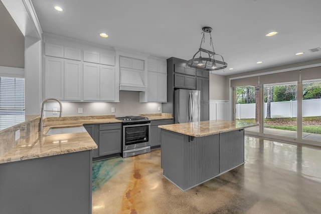 1118 Cotillion Dr, Murfreesboro, TN 37128 - kitchen featuring stainless steel appliances, a sink, light stone counters, and finished concrete floors