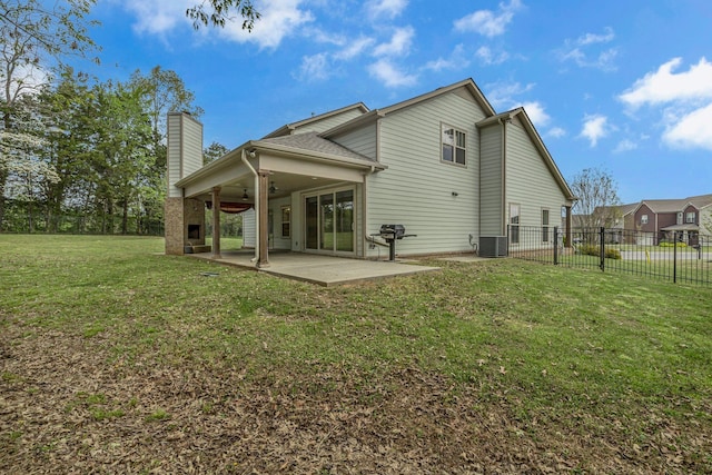 1118 Cotillion Dr, Murfreesboro, TN 37128 - rear view of house with central AC unit, a chimney, a lawn, a patio, and ceiling fan