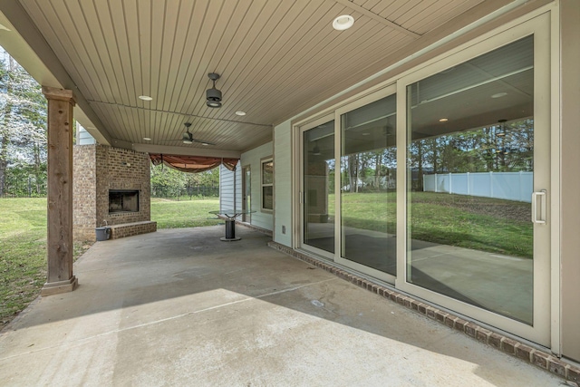 1118 Cotillion Dr, Murfreesboro, TN 37128 - view of patio featuring a ceiling fan, an outdoor brick fireplace, and fence