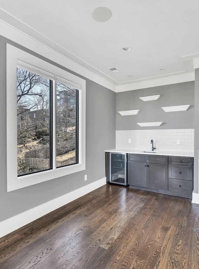 3503 Elkins Ave, Nashville, TN 37209 - bar with beverage cooler, wet bar, visible vents, a sink, and decorative backsplash