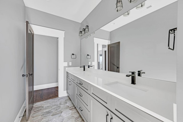 3503 Elkins Ave, Nashville, TN 37209 - bathroom with baseboards, a sink, visible vents, and double vanity