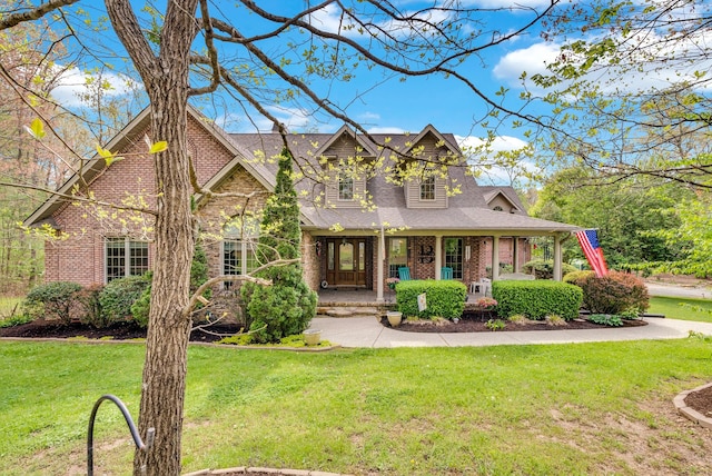 321 Clinchfield Dr, Monterey, TN 38574 - view of front of home featuring brick siding, roof with shingles, a porch, and a front yard