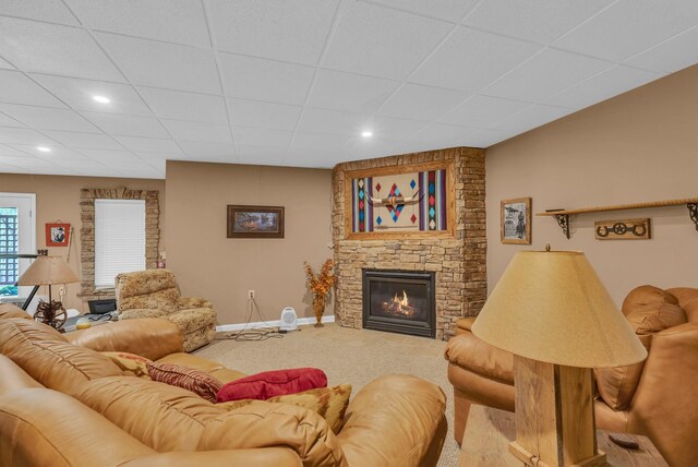 321 Clinchfield Dr, Monterey, TN 38574 - living room featuring a stone fireplace, baseboards, carpet, and a paneled ceiling