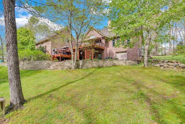 321 Clinchfield Dr, Monterey, TN 38574 - view of yard featuring a wooden deck and an attached garage