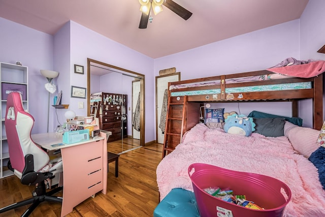 bedroom featuring wood finished floors, a closet, and ceiling fan