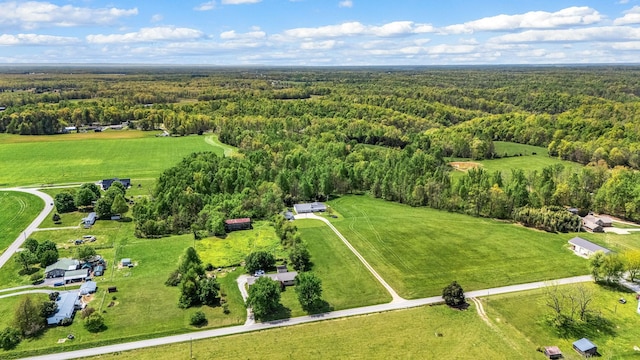 aerial view featuring a rural view and a view of trees