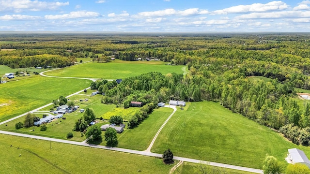 bird's eye view with a rural view and a wooded view