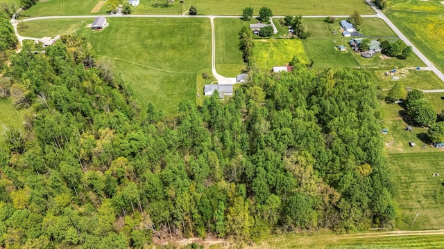 birds eye view of property with a rural view