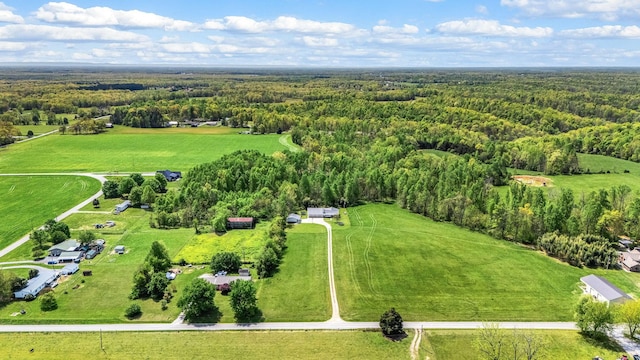 birds eye view of property with a rural view and a view of trees