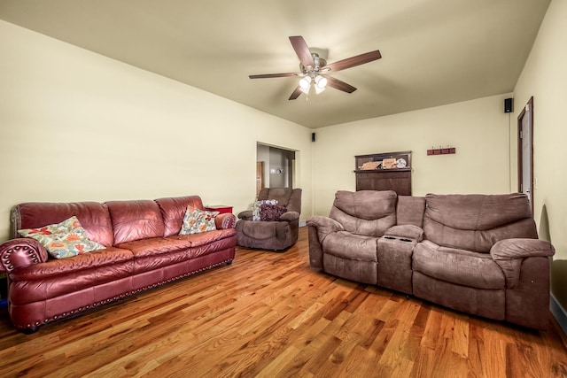 living room featuring a ceiling fan and wood finished floors