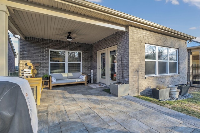 view of patio / terrace with an outdoor hangout area, ceiling fan, and french doors