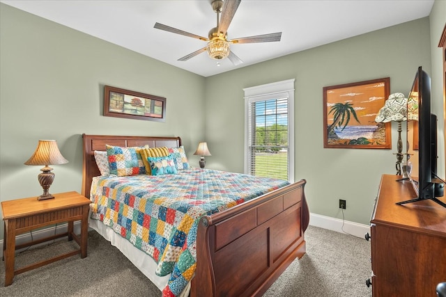 bedroom with ceiling fan, carpet floors, and baseboards