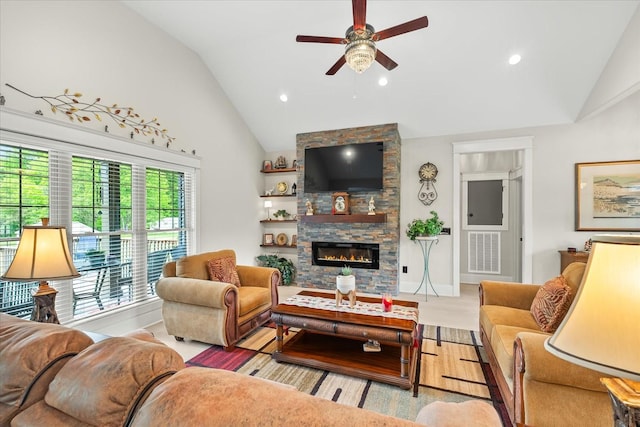 living area with ceiling fan, a stone fireplace, visible vents, and recessed lighting