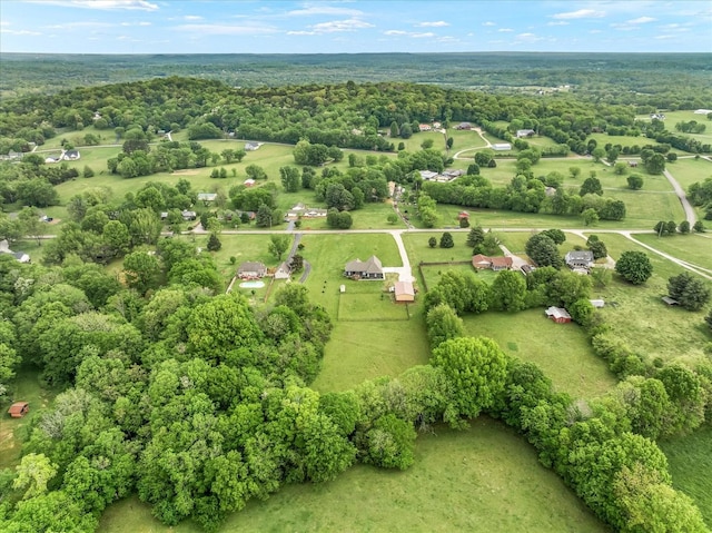 bird's eye view featuring a wooded view