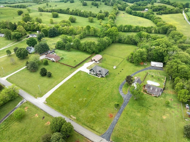 birds eye view of property with a rural view