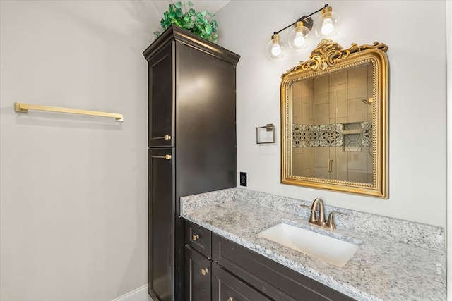 full bathroom with vanity and a stall shower
