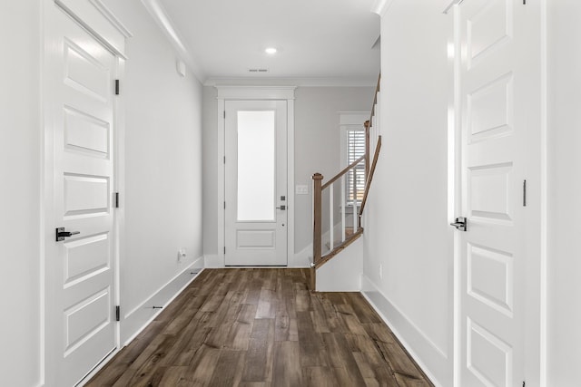 entryway featuring dark wood-style floors, stairway, crown molding, visible vents, and baseboards