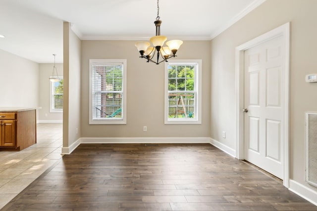 436 Conquest Rd N, Murfreesboro, TN 37128 - unfurnished dining area featuring a chandelier, ornamental molding, wood finished floors, and baseboards
