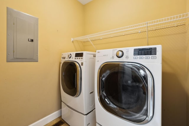 436 Conquest Rd N, Murfreesboro, TN 37128 - laundry room featuring electric panel, washing machine and dryer, and baseboards