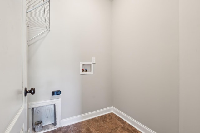 washroom with baseboards, electric dryer hookup, hookup for a washing machine, and laundry area