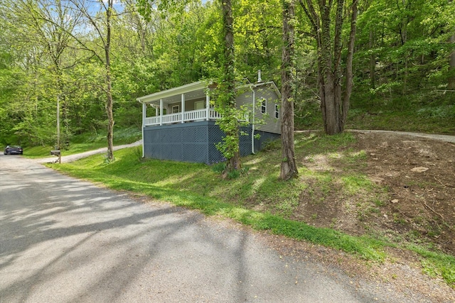 view of outdoor structure with a wooded view