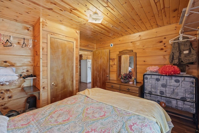 bedroom with wooden ceiling, wood walls, and wood finished floors