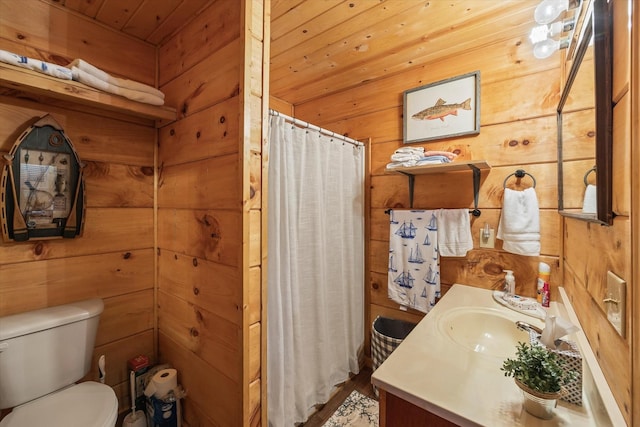 full bathroom featuring vanity, curtained shower, wooden walls, wooden ceiling, and toilet