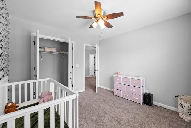 bedroom featuring ceiling fan, baseboards, carpet flooring, and a closet