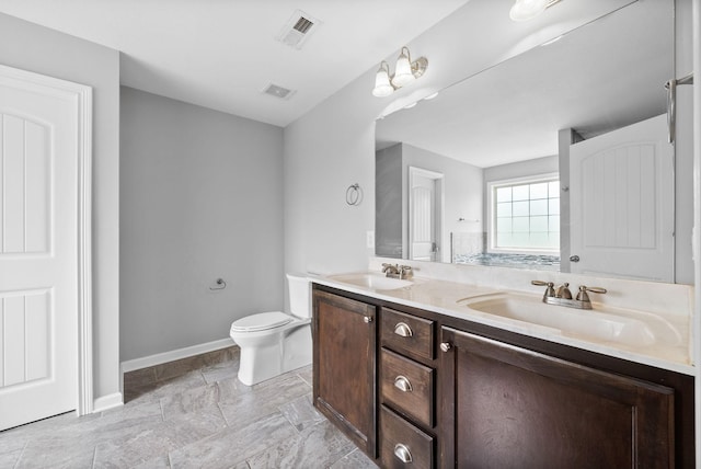 full bath featuring baseboards, visible vents, a sink, and toilet