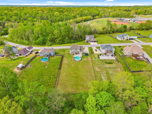 aerial view featuring a residential view and a forest view
