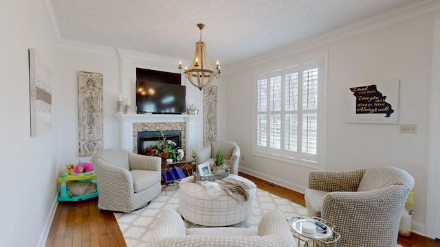 1100 Cypress Rd, Buchanan, TN 38222 - sitting room featuring an inviting chandelier, crown molding, and wood finished floors