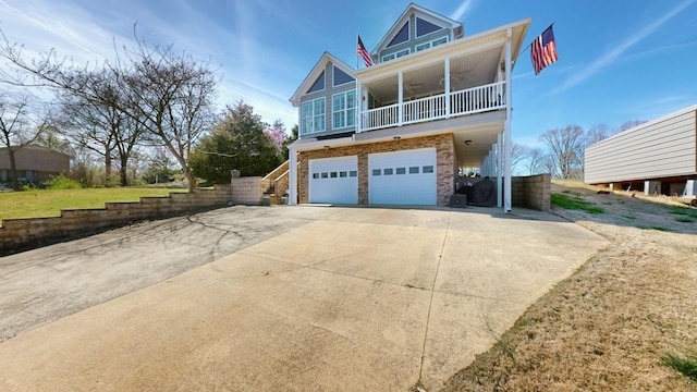 1100 Cypress Rd, Buchanan, TN 38222 - view of front of home with concrete driveway, stairway, and a garage