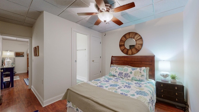 1100 Cypress Rd, Buchanan, TN 38222 - bedroom featuring baseboards, a paneled ceiling, wood finished floors, and ceiling fan