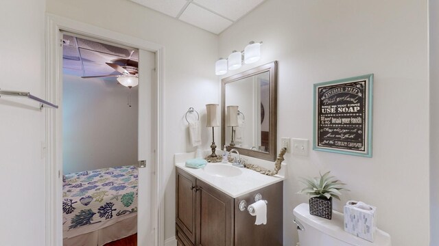 1100 Cypress Rd, Buchanan, TN 38222 - ensuite bathroom featuring toilet, vanity, ceiling fan, and ensuite bathroom