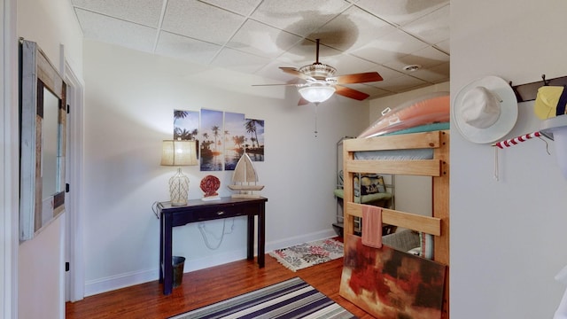 1100 Cypress Rd, Buchanan, TN 38222 - bedroom with baseboards, a paneled ceiling, and wood finished floors