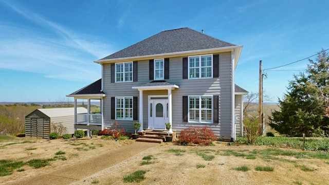 1100 Cypress Rd, Buchanan, TN 38222 - colonial inspired home with an outdoor structure, a shed, and a shingled roof