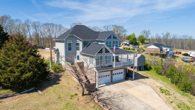 1100 Cypress Rd, Buchanan, TN 38222 - view of front of property with a garage, roof with shingles, stone siding, and concrete driveway