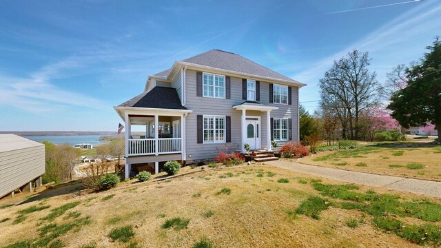 1100 Cypress Rd, Buchanan, TN 38222 - colonial home with a shingled roof and a water view